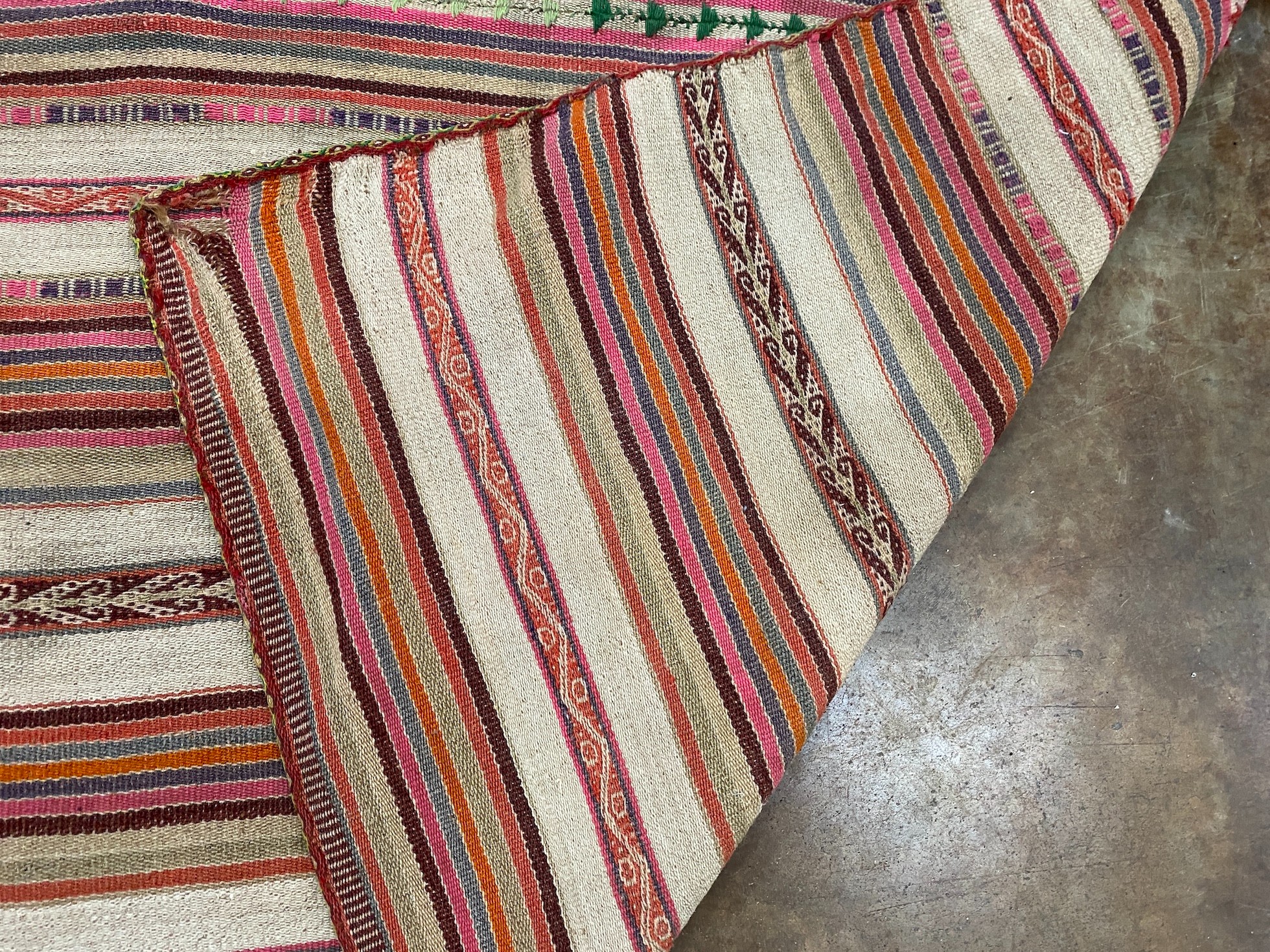 A flatweave Kilim rug, woven with a geometric design 120cm x 106cm
